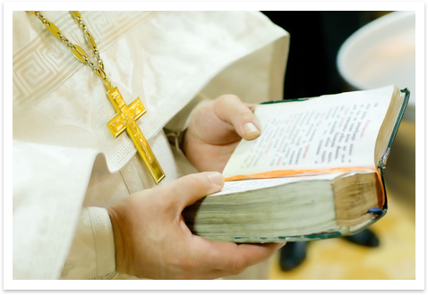 A priest reading book